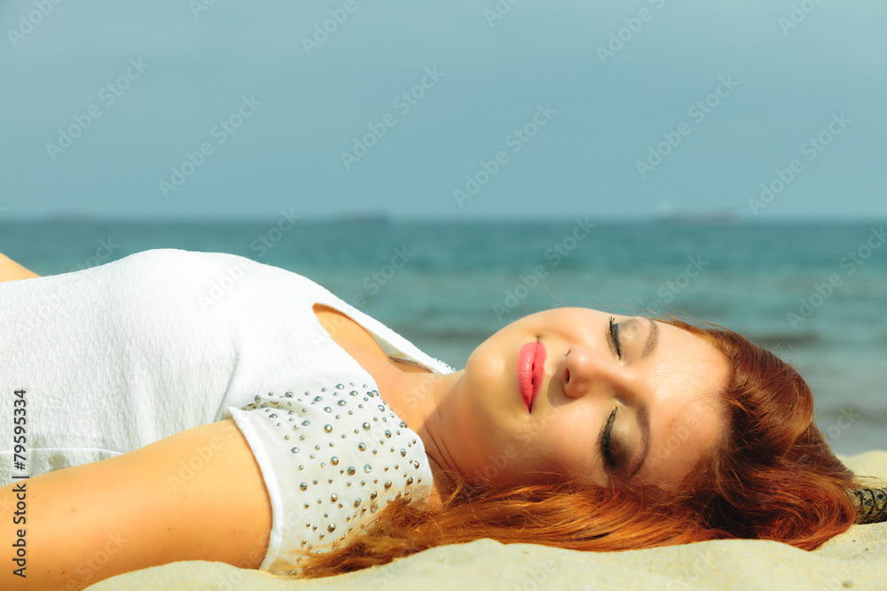 Beautiful redhaired girl on beach, portrait Beautiful redhaired girl on beach, portrait