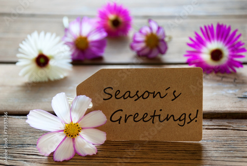 Label With Text Seasons Greetings With Cosmea Blossoms