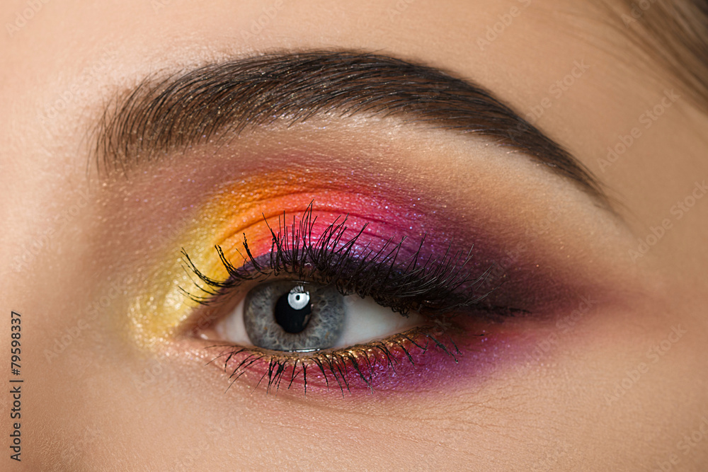 Fototapeta premium Close-up of woman eye with beautiful colourful makeup