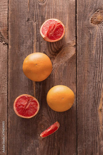 Fototapeta Naklejka Na Ścianę i Meble -  Ripe grapefruits on wooden background