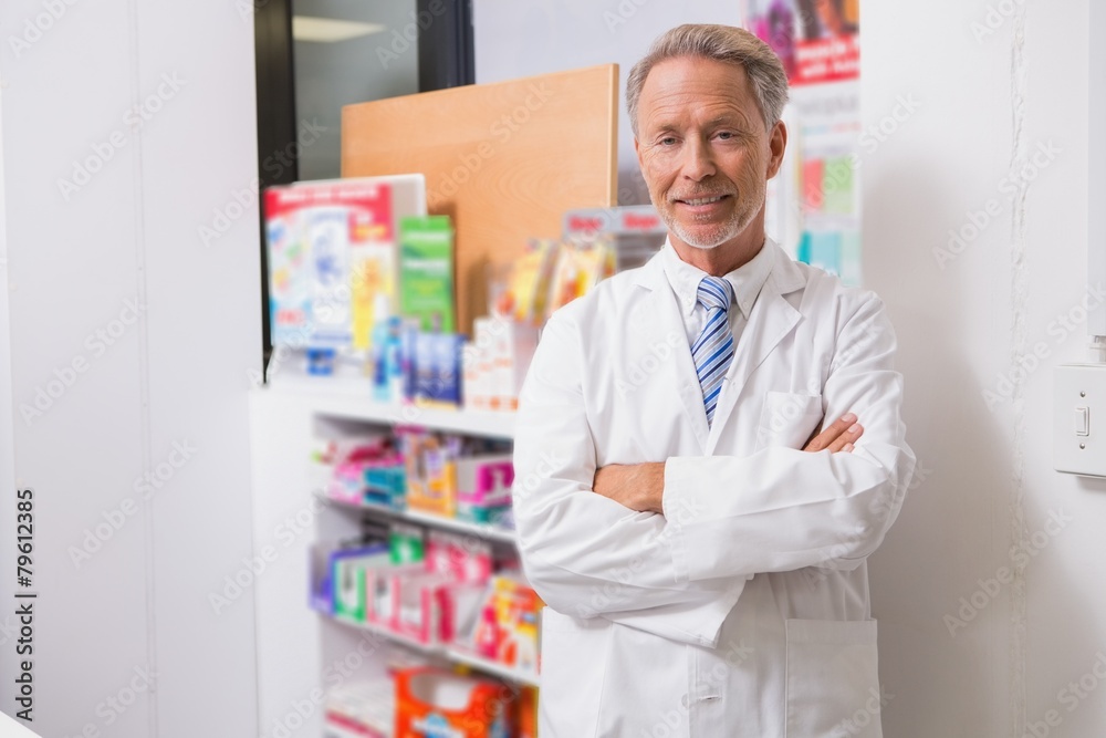 Senior pharmacist smiling at camera Senior pharmacist smiling at camera