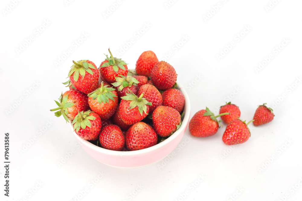 Small white bowl filled with red strawberries Small white bowl filled with red strawberries