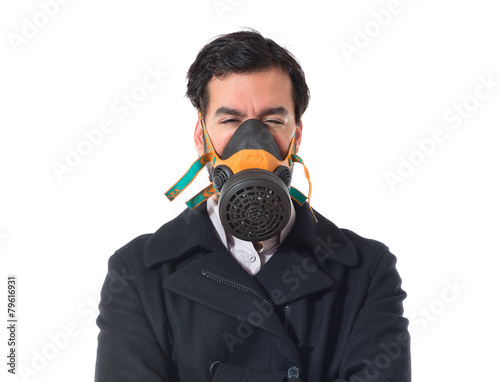 Handsome man in gas mask © luismolinero