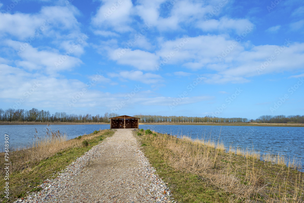 Bird hide along the shore of a lake Bird hide along the shore of a lake