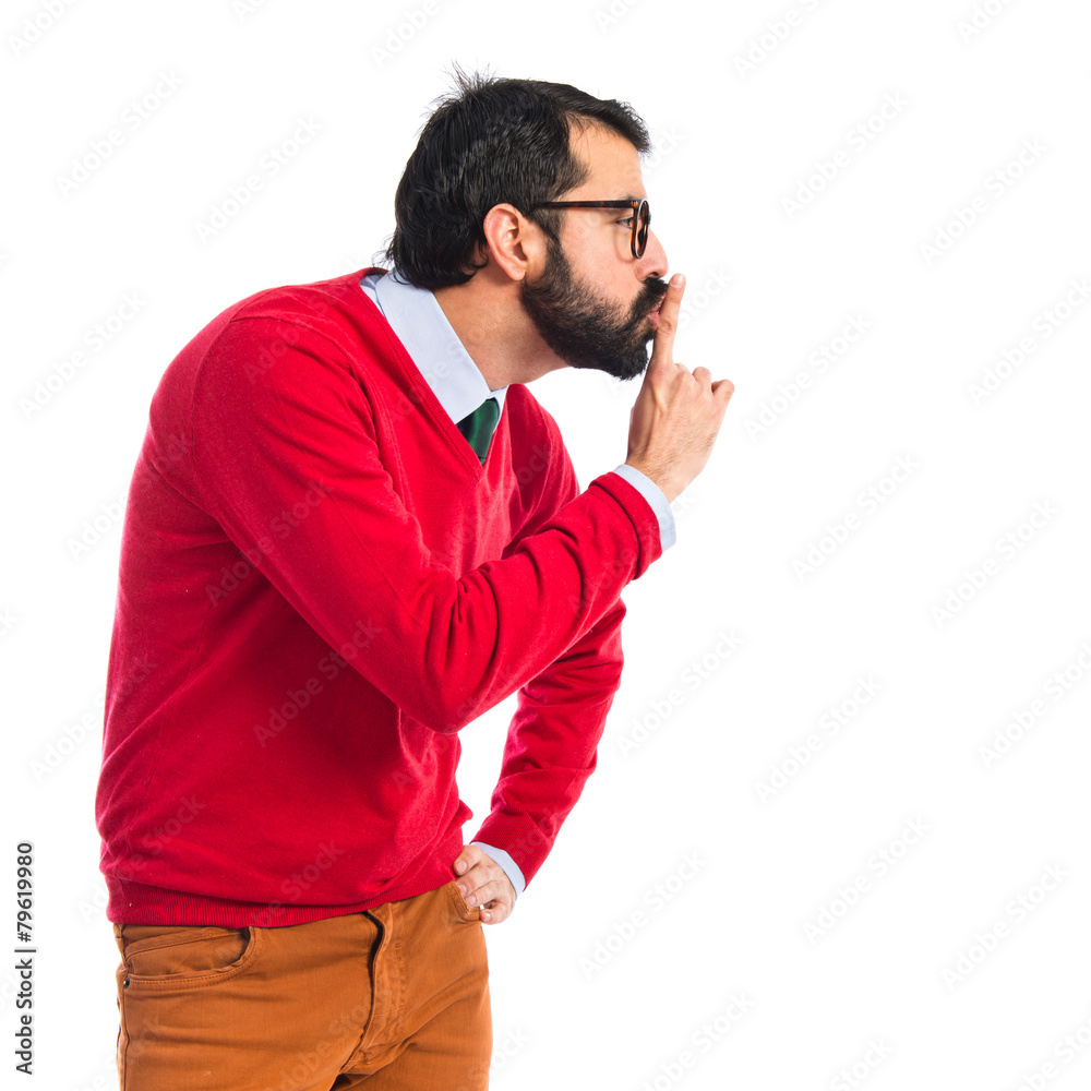 Hipster man making silence gesture