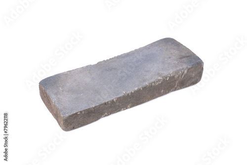 Sharpening or honing a knife on a waterstone, grindstone on the