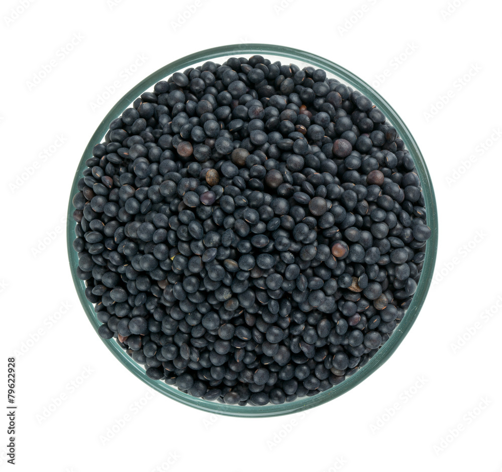 black lentils in a bowl isolated on white black lentils in a bowl isolated on white