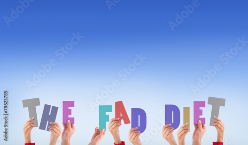Composite image of hands holding up the fad diet