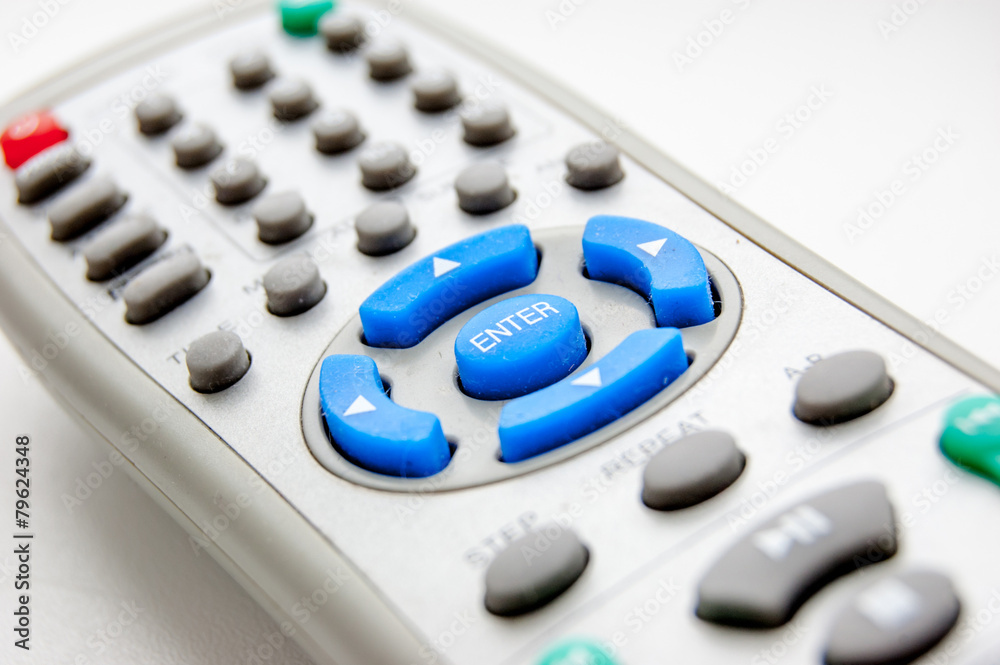 Angle view of white remote control closeup Angle view of white remote control closeup