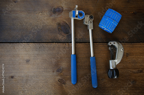 Fotografía Tube bender or pipe bender tools on wooden background.