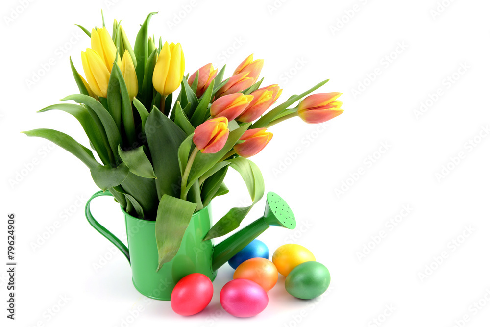 easter eggs around water can vase with Tulips