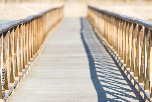 Wooden bridge over water with short depth of field