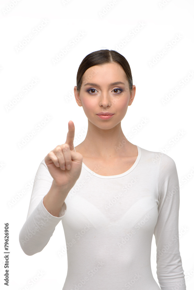 Young woman looking and pointing at camera