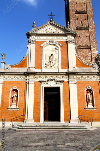 in  the mozzate  old   church  closed brick tower sidewalk photo