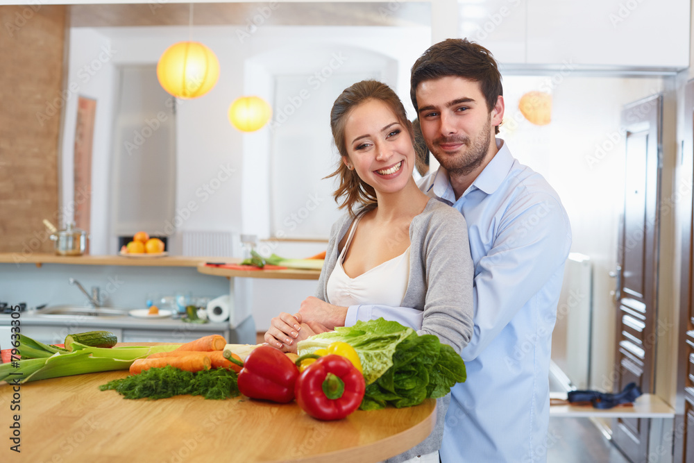 Young Сouple Сooking in The Kitchen. Healthy food