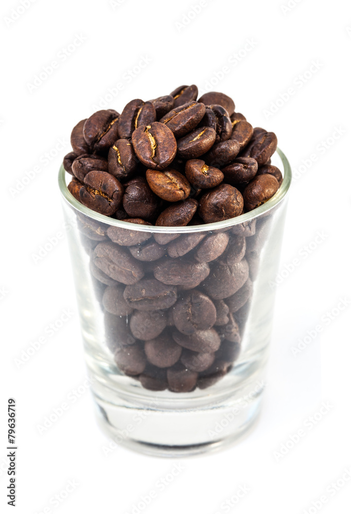 coffee beans in glass shot isolated on white background coffee beans in glass shot isolated on white background