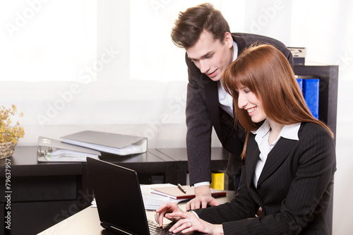 Teamwork in the office on the laptop