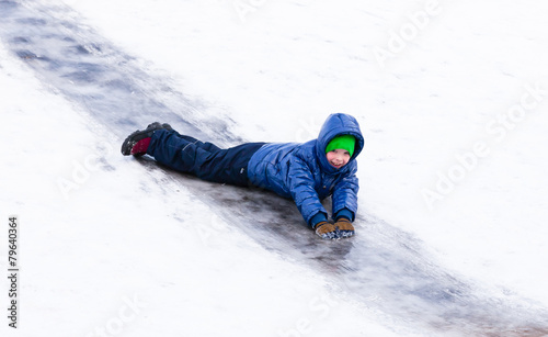 Boy riding the hills in winter