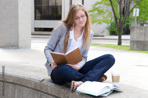 Cheerful student studying on campus