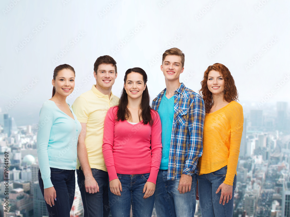 group of smiling teenagers over city background group of smiling teenagers over city background