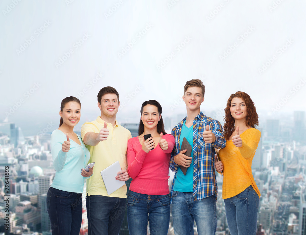 group of teenagers with smartphones and tablet pc group of teenagers with smartphones and tablet pc