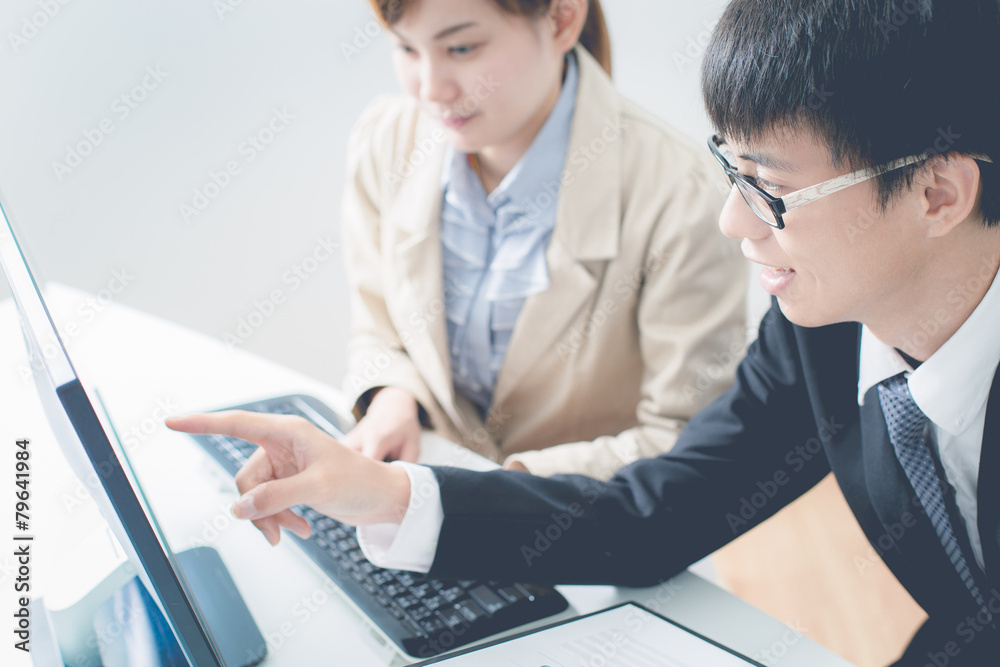 Business people discussing the charts and graphs showing the res Business people discussing the charts and graphs showing the res