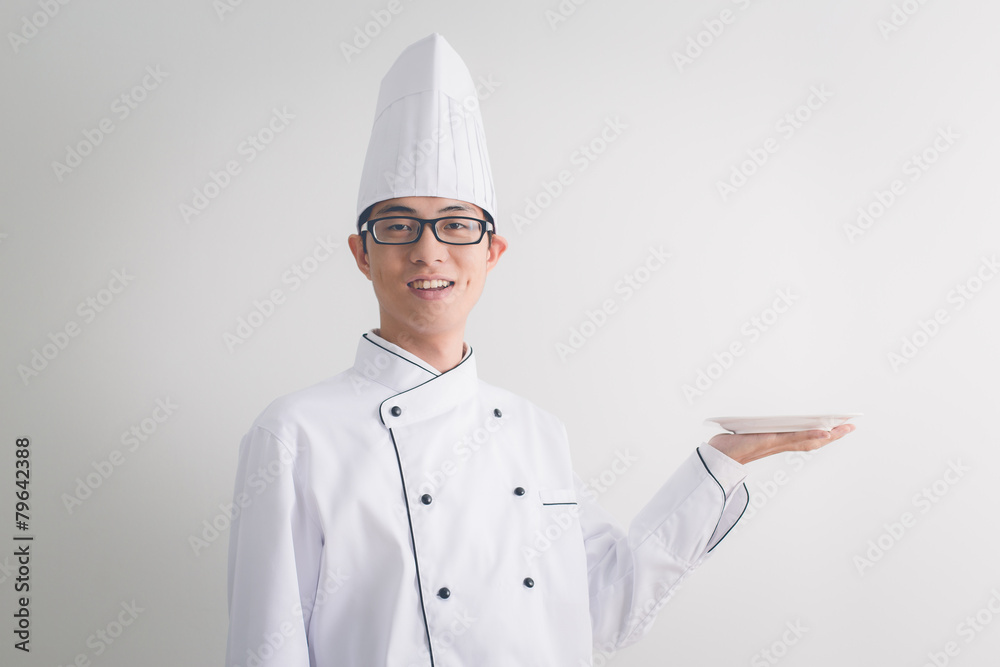 Young chef with arms crossed smiling Young chef with arms crossed smiling