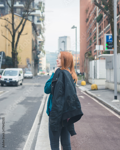 Beautiful girl posing in the city streets