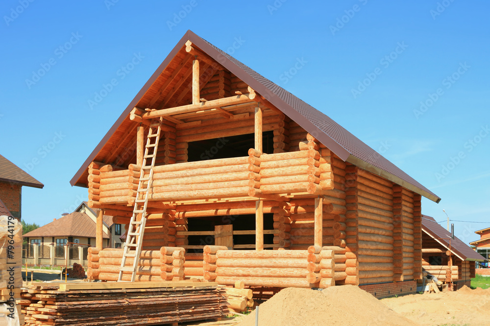 Wooden housing construction. New wooden house Wooden housing construction. New wooden house