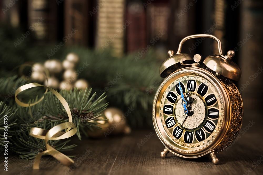 Vintage watch on a festive background showing five to midnight