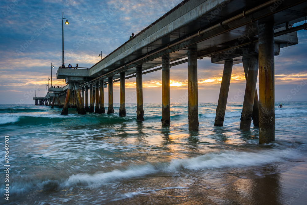 Waves in the Pacific Ocean and the pier at sunset, in Venice Bea