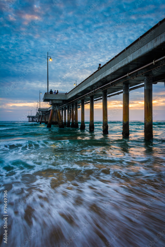 Waves in the Pacific Ocean and the pier at sunset, in Venice Bea