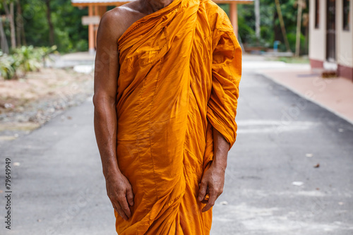 Buddhist monk meditation in standing pose in peace