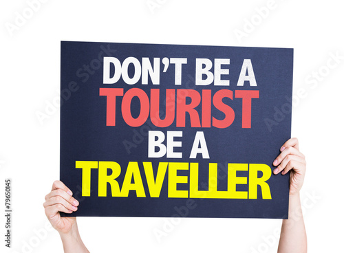 Don't be a Tourist Be a Traveller card isolated on white
