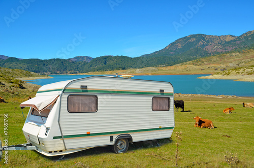 car caravan trailer in spring, lake mountain