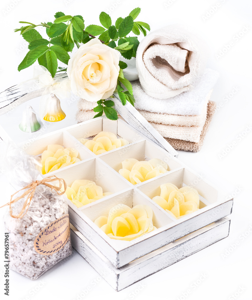 Spa and wellness setting with soap, bath salts and towels