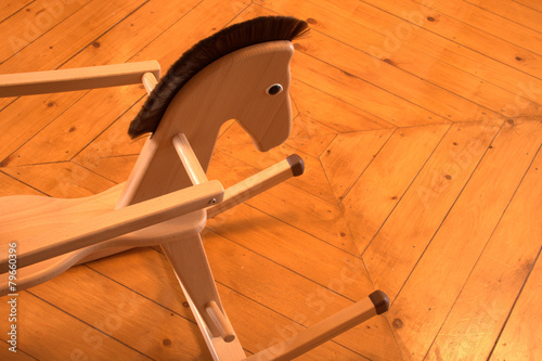 Rocking horse on wooden floor in a nursery