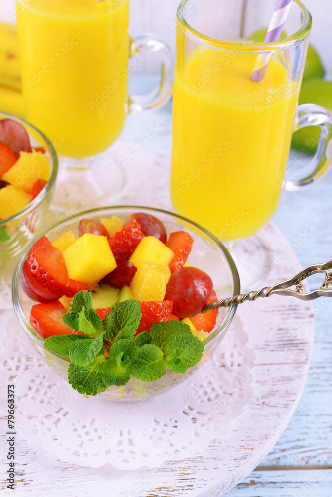 Fruit salad with mint and orange juice in glassware Fruit salad with mint and orange juice in glassware