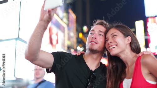 Dating young couple taking selfie in New York
