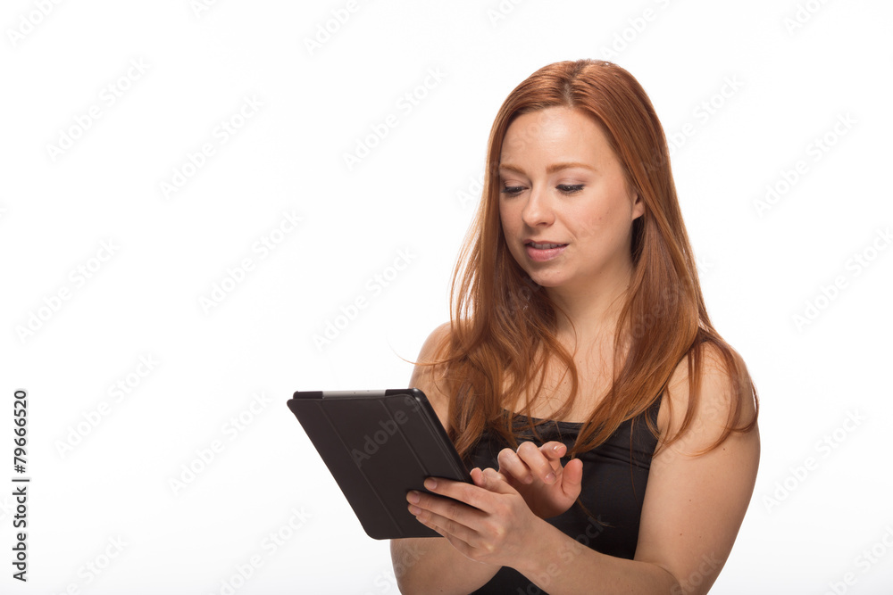 Young Caucasian woman using tablet pc computer Young Caucasian woman using tablet pc computer