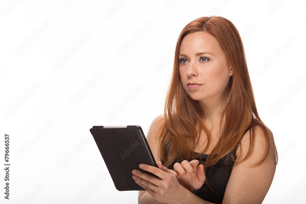 Young Caucasian woman using tablet pc computer Young Caucasian woman using tablet pc computer