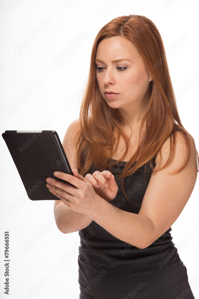 Young Caucasian woman using tablet pc computer Young Caucasian woman using tablet pc computer