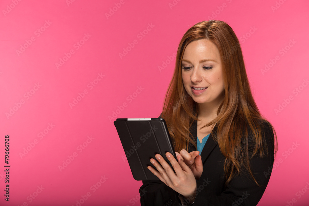 Young Caucasian woman using tablet pc computer Young Caucasian woman using tablet pc computer