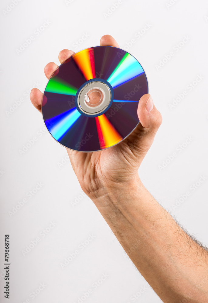 Hand Holding DVD CD Disc Against White Background Hand Holding DVD CD Disc Against White Background