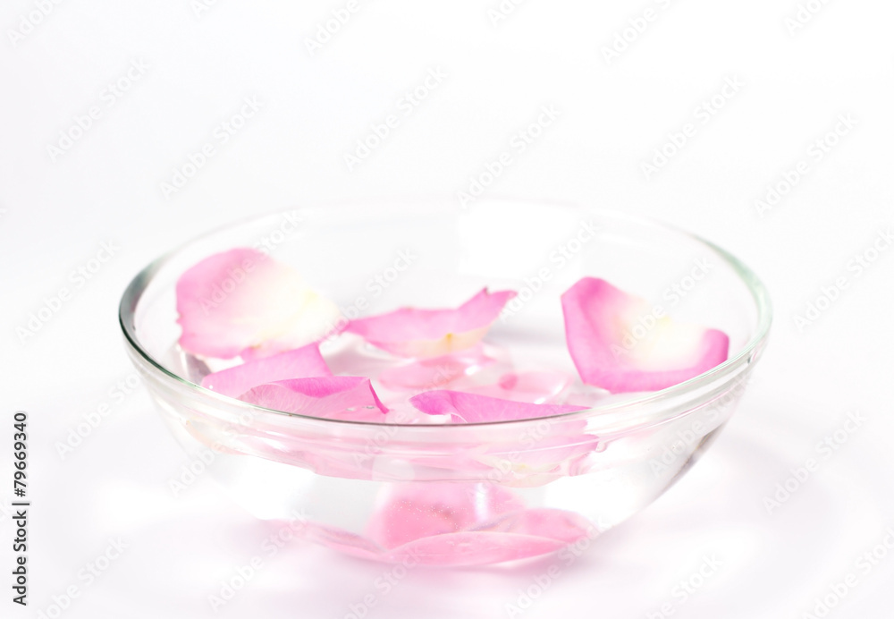 Infused water with rose petals in a reflection bowl Infused water with rose petals in a reflection bowl