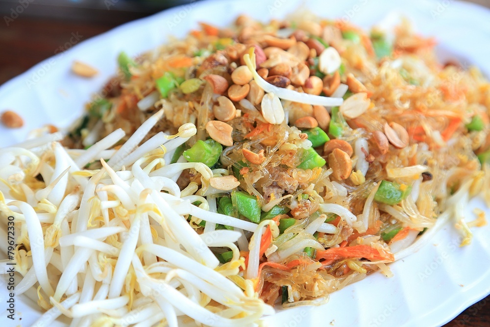 Pad thai noodles in white plate - thai food Pad thai noodles in white plate - thai food