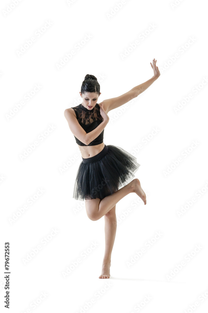 Obraz premium Young attractive ballerina doing alternate dance moves