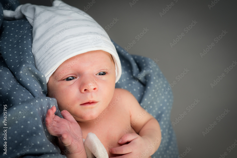 beautiful newborn baby boy isolated on gray a background beautiful newborn baby boy isolated on gray a background