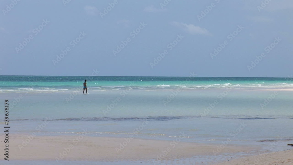 LUCAYAN BEACH/GRAND BAHAMA MARCH 2011: Man in sea at beach LUCAYAN BEACH/GRAND BAHAMA MARCH 2011: Man in sea at beach