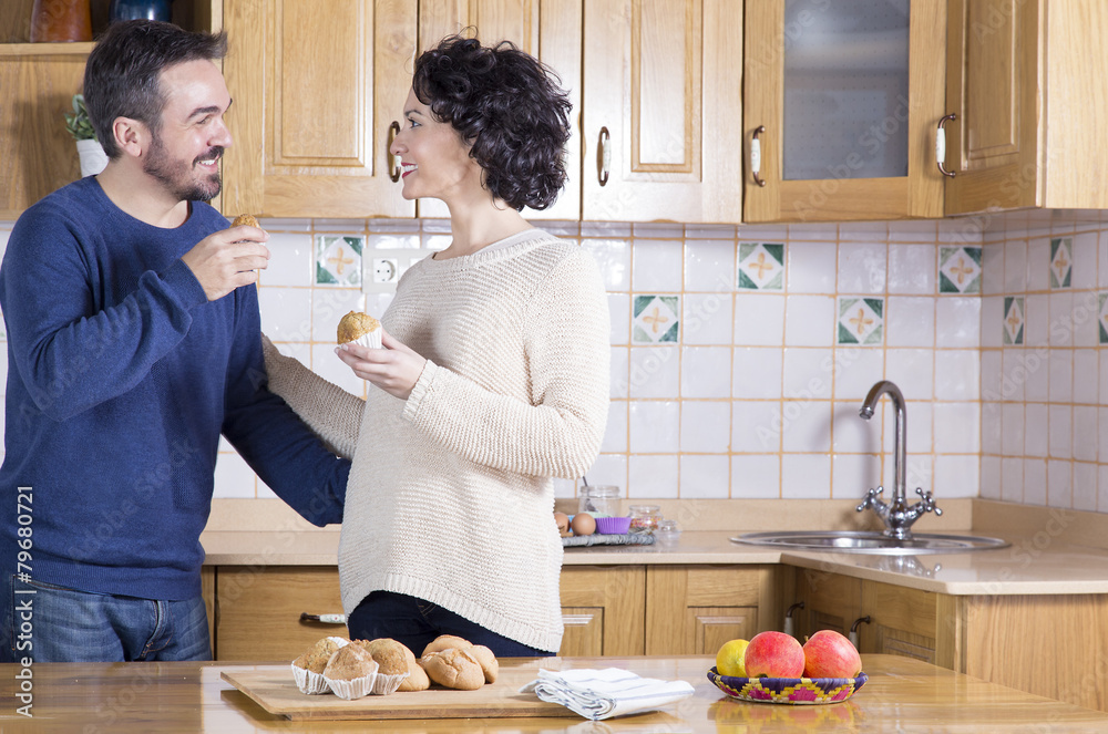 Man and woman eating homemade cupcakes Man and woman eating homemade cupcakes